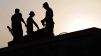 construction workers on a roof