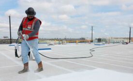 An installer uses GacoFlex on a commercial roof