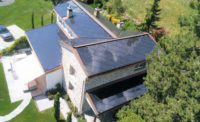 A residential home with SunStyle photovalic solar cells embedded in the roof.