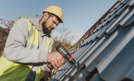 sideways-man-working-roof-with-drill.jpg