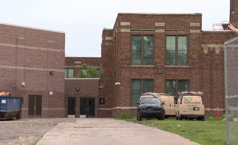 Detroit roofer dies after falling through the roof of a school.