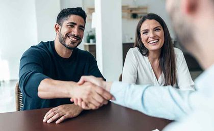 A man and a woman meeting with a financial advisor