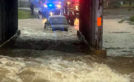 Heavy rains flooded roads and caused the partial roof collapse of a Cargill meat processing plant in Dodge City, Kan.