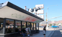 The cow that has stood atop the Top Spot eatery in Cedar City, Utah, came down for the last time in early August. Photo by Jeff Richards, St. George News