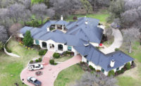 A new metal roof on a large Texas home