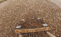 A sample of roofing shingles taking extensive damage from hail