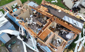 A home in North Fort Myers, Fla., that had its roof ripped off the house.