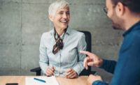 A man talks to an older woman