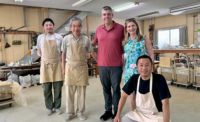 Ken Kelly (center) with his wife, Jennifer, in Japan at a roofing company